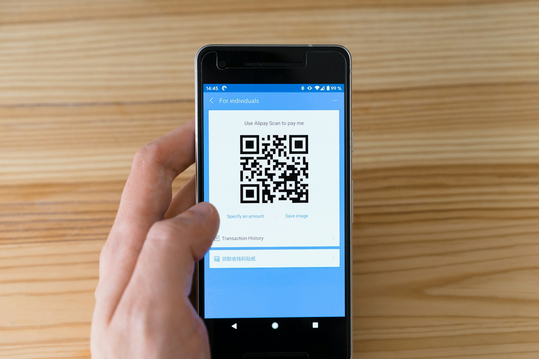 Phone displaying a QR code for scanning